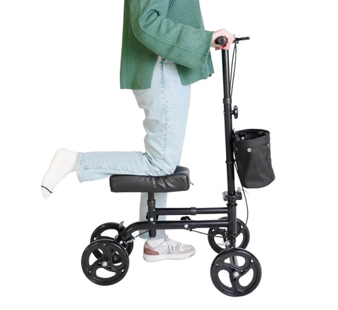 Person using a knee walker on a white background