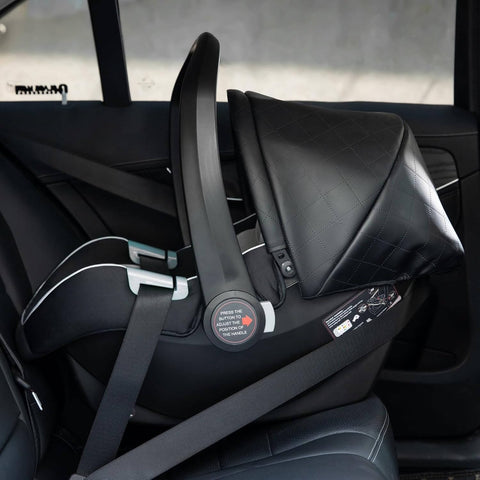 Black car seat with straps inside a vehicle