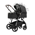Black baby stroller with canopy on a white background