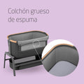 Baby crib with a thick foam mattress on a purple background