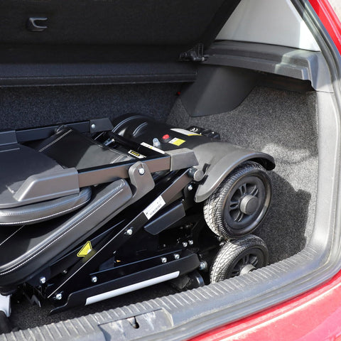 Mower in a car trunk
