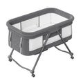 Portable baby crib with gray fabric sides and white interior on a white background