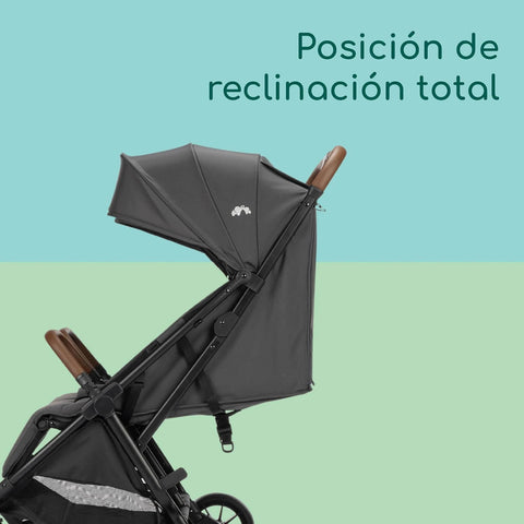 Black stroller with reclined canopy on a gradient background