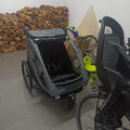 Bicycle with a child seat attached in a garage setting.